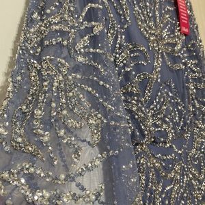 Modest long sleeve embellished gown.Extensive beadwork with pearls.